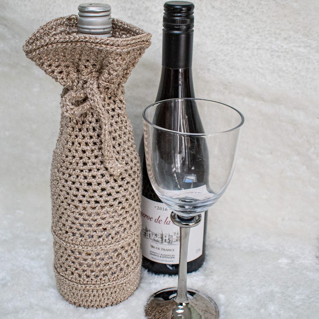 the texture on this wine bottle cozy makes it a quick gift idea