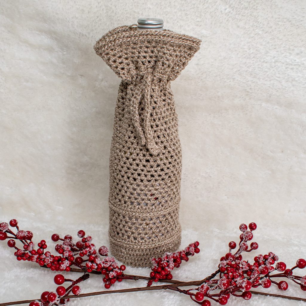 This wine bottle cozy is a great beginner pattern for those confident with the chains, single and half double crochets!