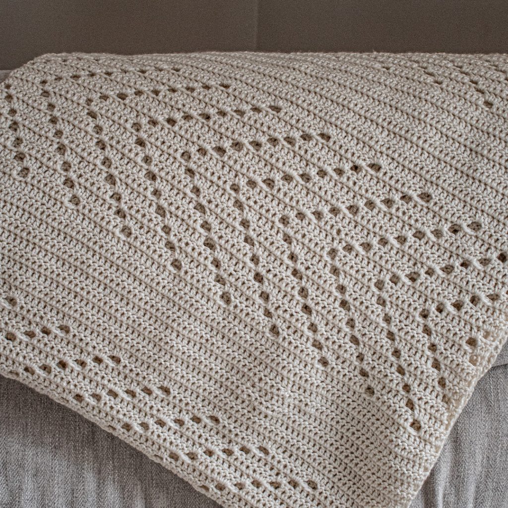 easy filet crochet blanket pattern looks great in a solid colour
