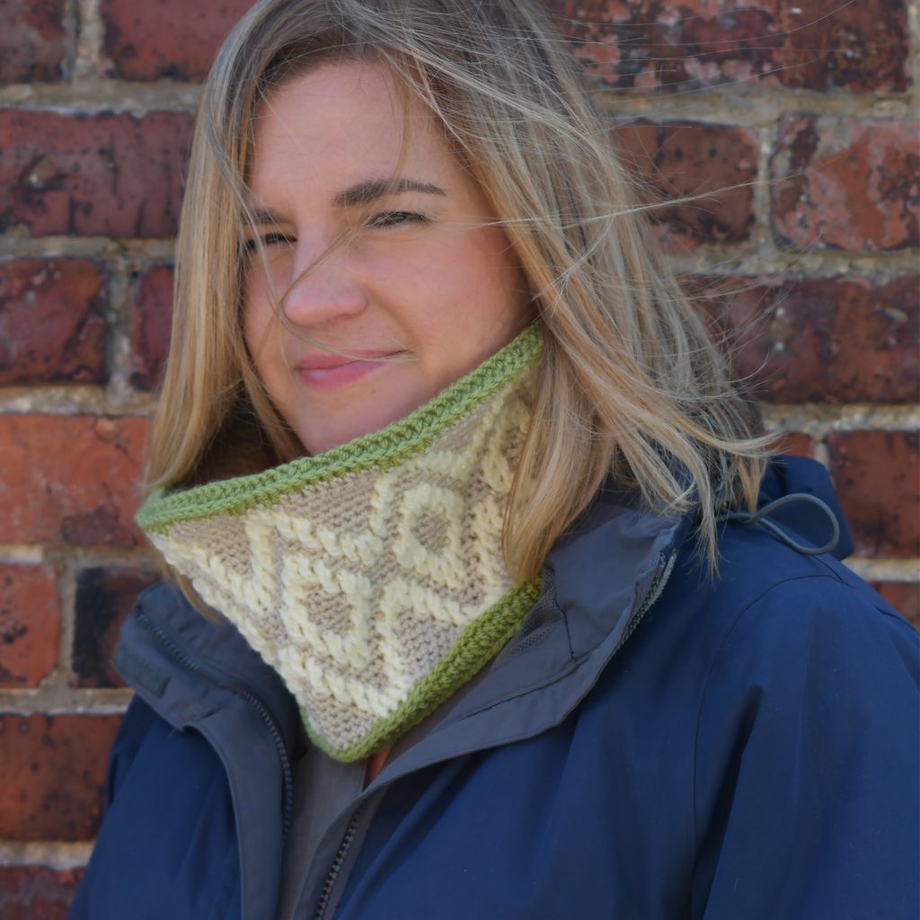 The cabled cowl looks fabulous on