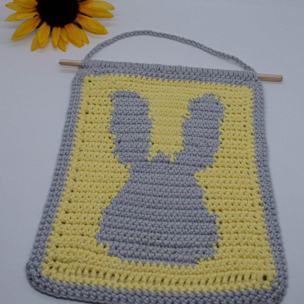 Use this bunny crochet wall hanging in a nursery, around the home, or even in a classroom!