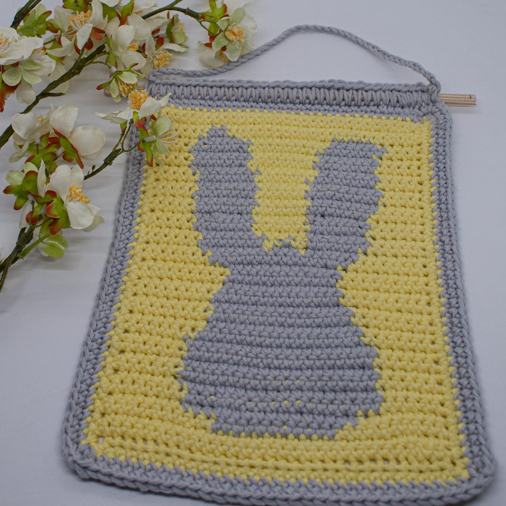 This crochet wall hanging is perfect for Spring decoration around the home or nursery decorations!
