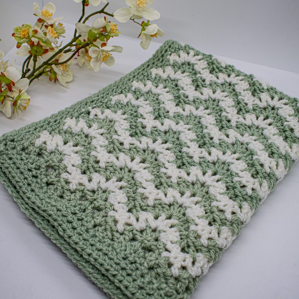 This baby blanket crochet pattern works up really quite quickly.