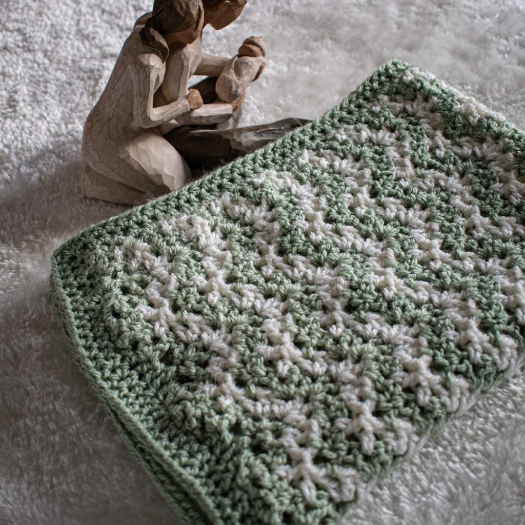 This baby blanket crochet pattern is so much fun to work up! Video tutorials are included.