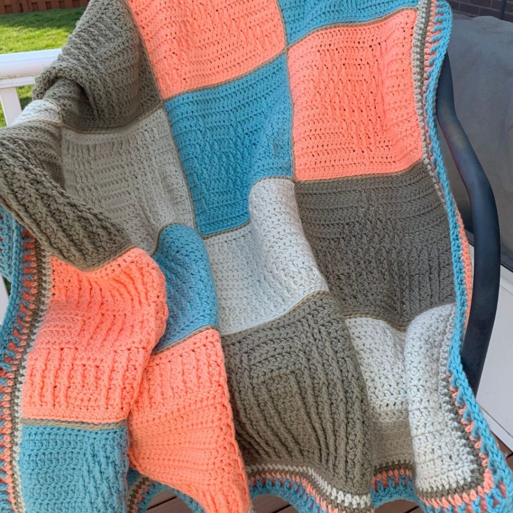 All go the blanket squares from the Here Comes the Treble Event make up this fantastic blanket!